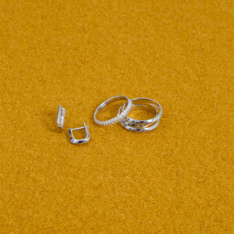 Still life image of LAB-Created Pave Silver Knife Edge Stacking Ring with Stone and Strand solid gold jewelry