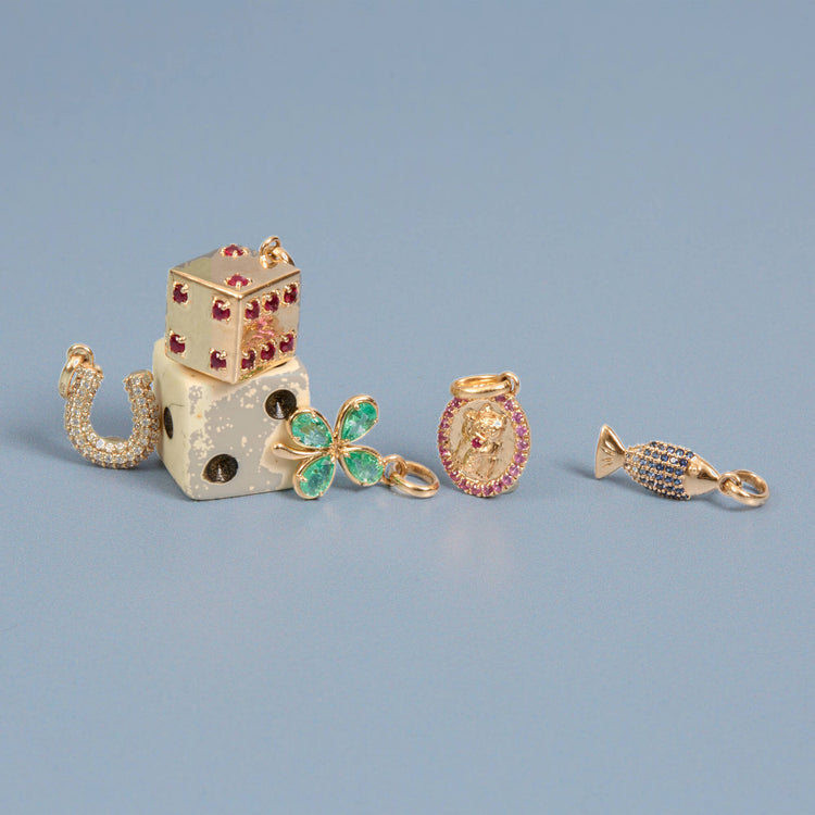 Still life image of Lady Luck Ruby Dice Charm with Stone and Strand solid gold jewelry