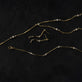 Still life image of LAB-Created Morse Code Lariat Necklace with Stone and Strand solid gold jewelry