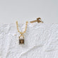 Still life image of Almost Forever Pave Key Charm with Stone and Strand solid gold jewelry