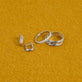 Still life image of Silver Knife Edge Hoop Duo Set with Stone and Strand solid gold jewelry