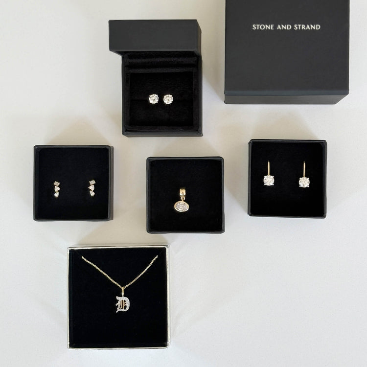 Still life image of Lab-Created Classic Diamond Studs with Stone and Strand solid gold jewelry