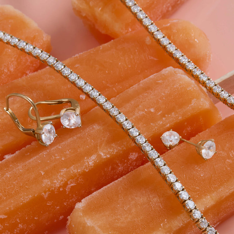 Still life image of Lab-Created Classic Diamond Studs with Stone and Strand solid gold jewelry