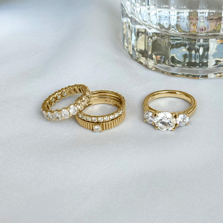 Still life image of LAB-Created Oval Eternity Band with Stone and Strand solid gold jewelry