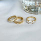 Still life image of LAB-Created Oval Eternity Band with Stone and Strand solid gold jewelry