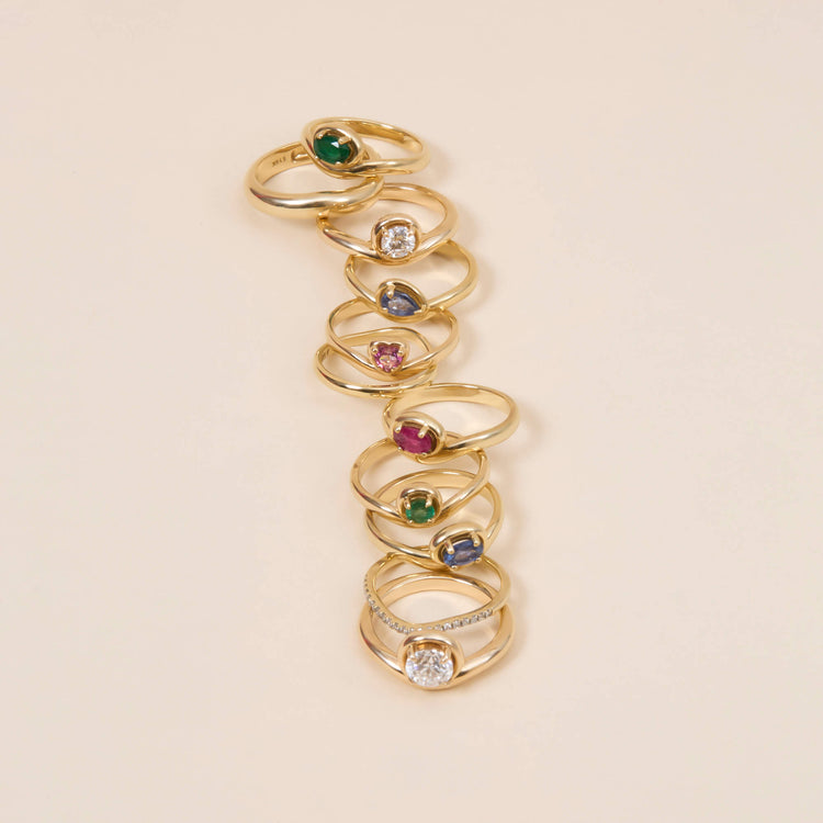 Still life image of Green With Envy Merge Ring with Stone and Strand solid gold jewelry