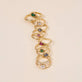 Still life image of Emerald Bonbon Merge Ring with Stone and Strand solid gold jewelry