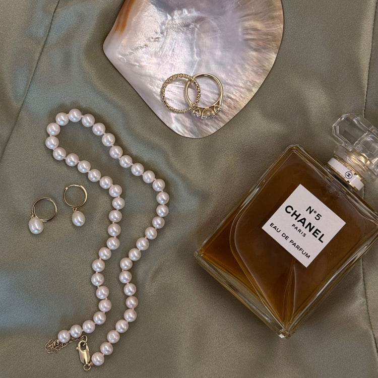 Still life image of Elliptical Pearl Huggies with Stone and Strand solid gold jewelry