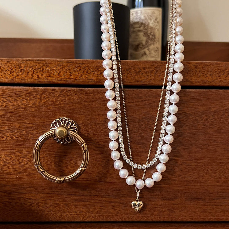 Still life image of Diamond Sweetheart Locket with Stone and Strand solid gold jewelry