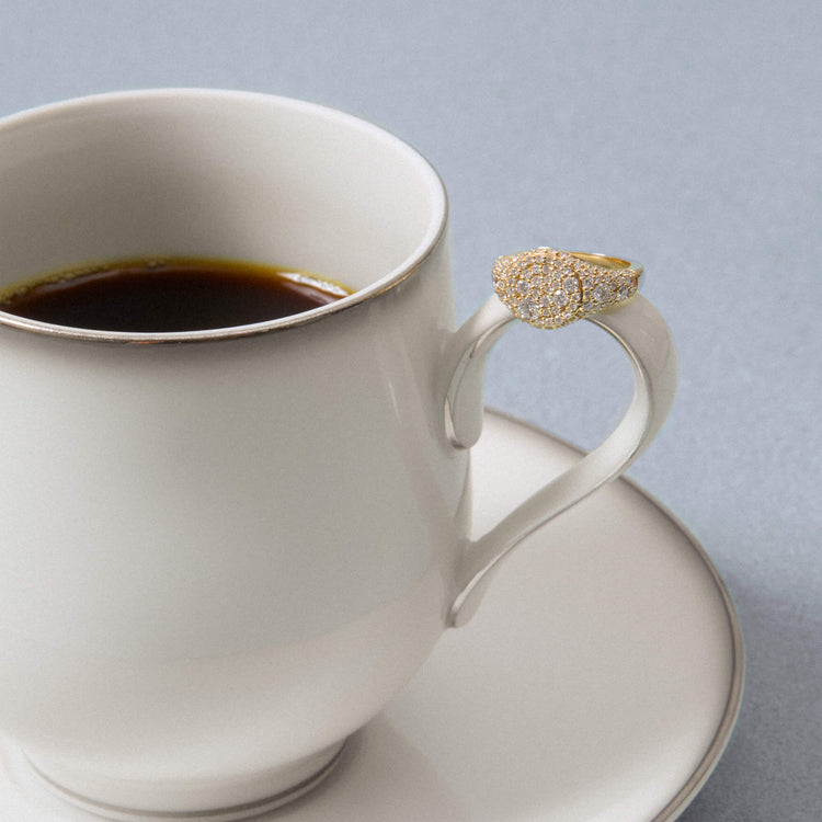 Still life image of The Standard Diamond Signet Ring with Stone and Strand solid gold jewelry