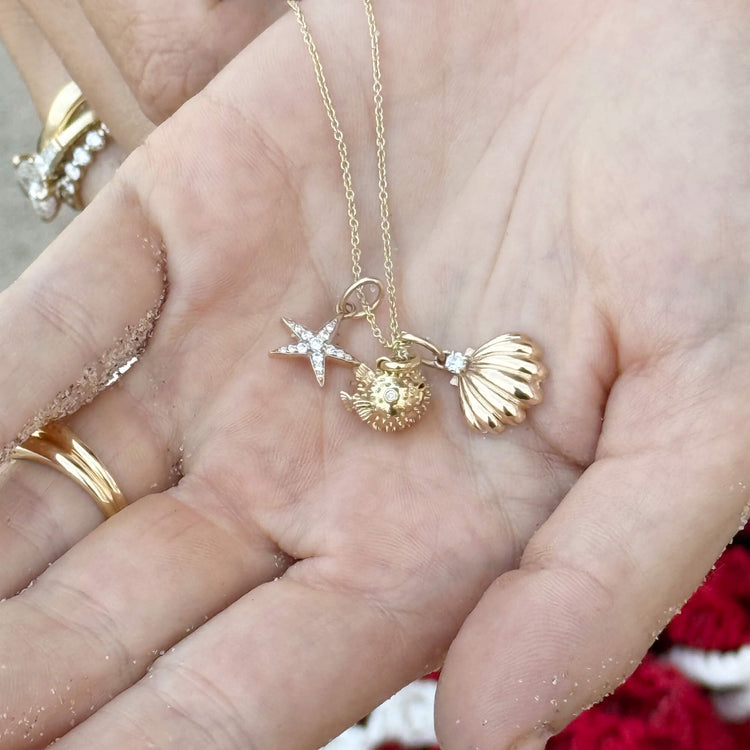 Still life image of Vintage Scallop Shell Necklace with Stone and Strand solid gold jewelry