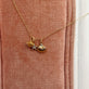 Still life image of Vintage Scallop Shell Necklace with Stone and Strand solid gold jewelry