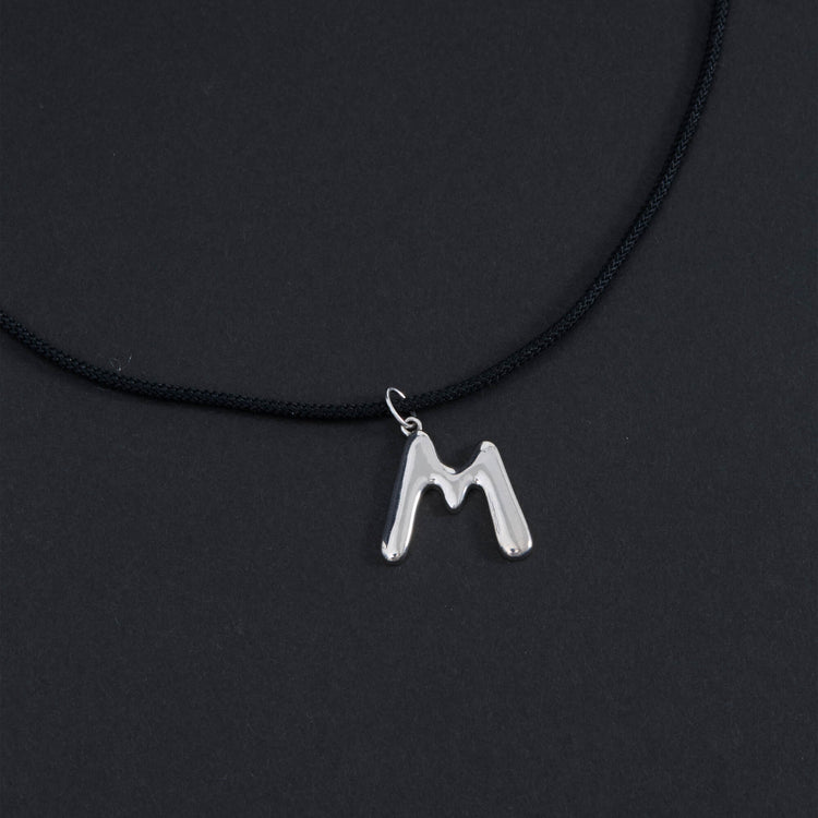 Stone and Strand Sterling Silver XL Silver Blob Initial Necklace Editorial Image