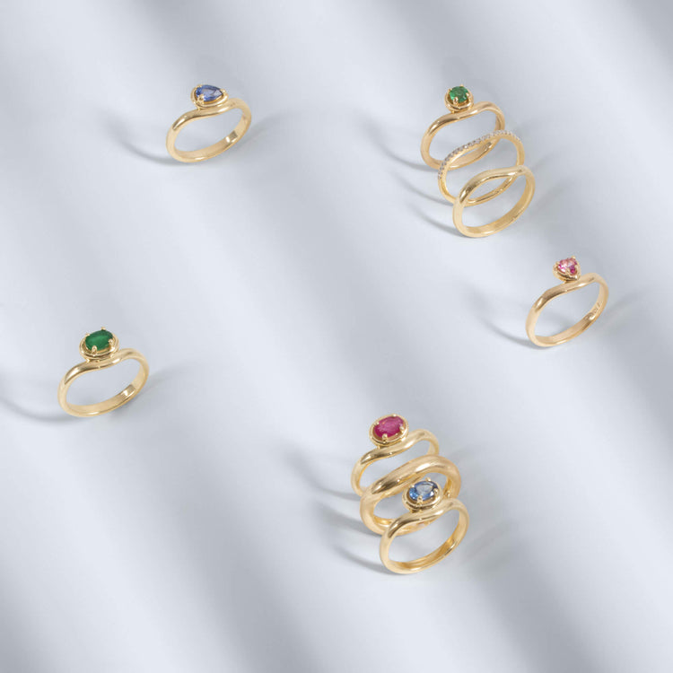 Still life image of Bold Merge Ring with Stone and Strand solid gold jewelry
