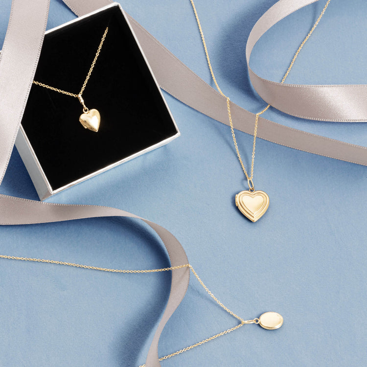 Still life image of Wholehearted Locket with Stone and Strand solid gold jewelry