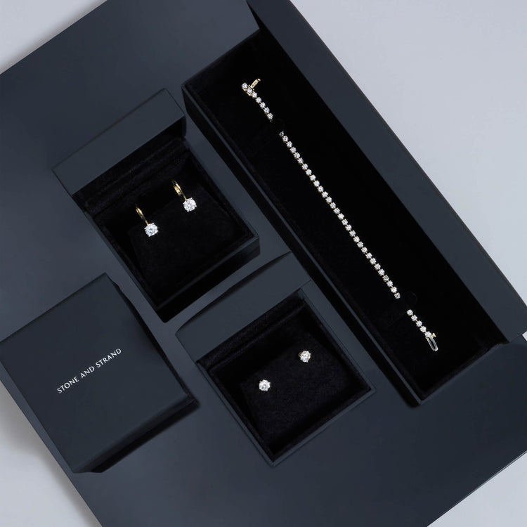 Still life image of Lab-Created Classic Diamond Studs with Stone and Strand solid gold jewelry