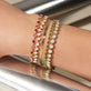 Model wearing Emerald Ace Tennis Bracelet with solid gold Stone and Strand jewelry