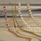 Still life image of Emerald Ace Tennis Bracelet with Stone and Strand solid gold jewelry