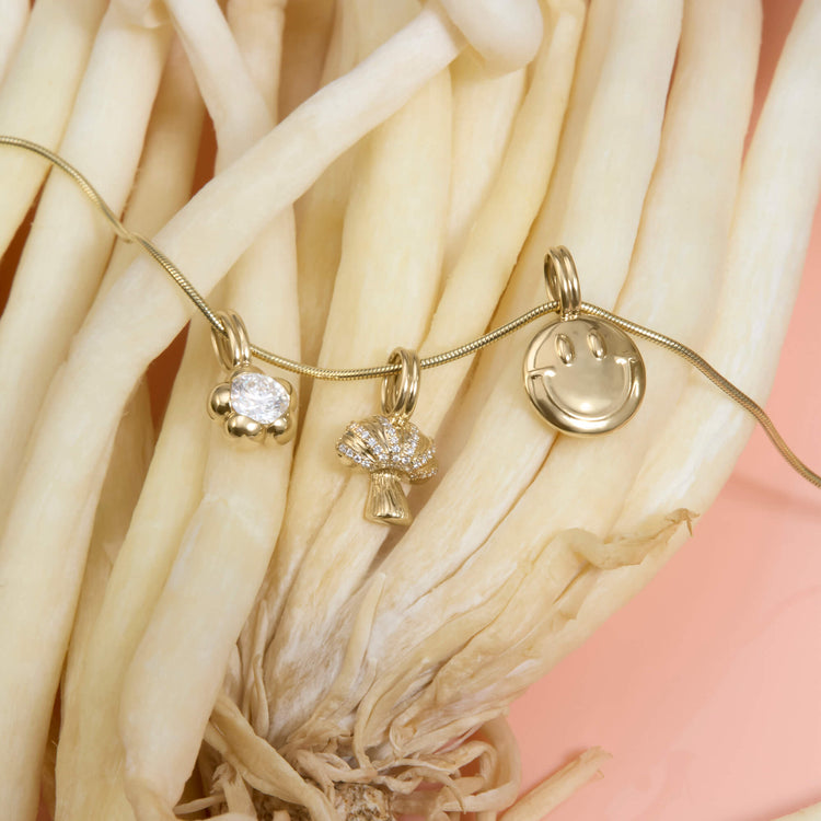 Still life image of Thin Snake Bracelet with Stone and Strand solid gold jewelry