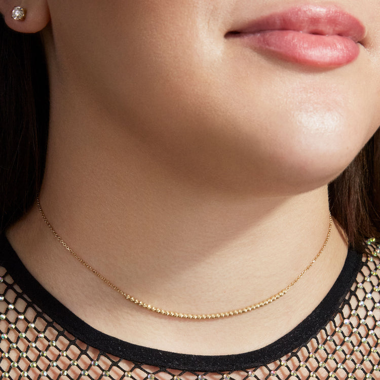 Model wearing Glitter in the Sky Choker with solid gold Stone and Strand jewelry