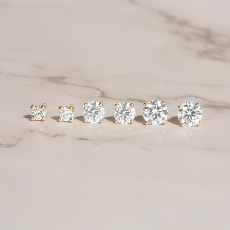 Still life image of Lab-Created Diamond Studs with Stone and Strand solid gold jewelry