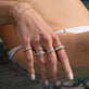 Model wearing Fine Diamond Pave Chain Ring with solid gold Stone and Strand jewelry