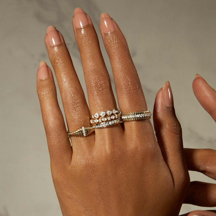 Model wearing Diamond Pirouette Band with solid gold Stone and Strand jewelry