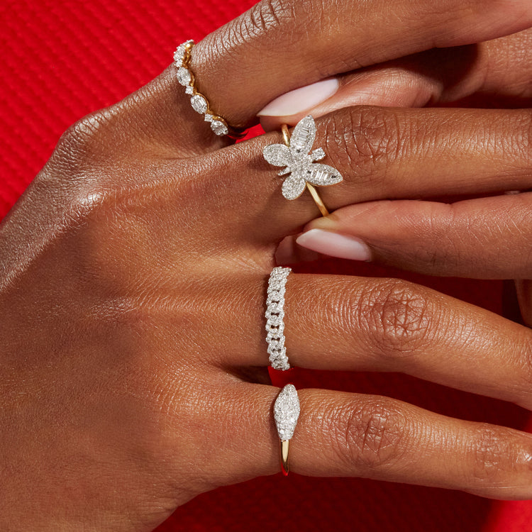 Model wearing Oval Opulence Diamond Ring with solid gold Stone and Strand jewelry