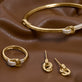 Still life image of Diamond Forme Knot Ring with Stone and Strand solid gold jewelry