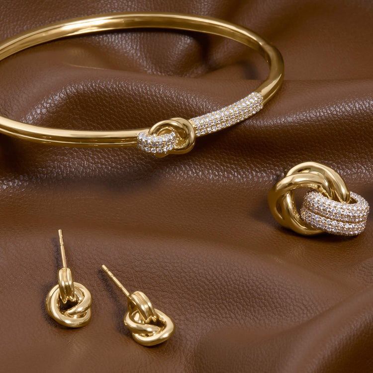 Still life image of Diamond Forme Knot Earrings with Stone and Strand solid gold jewelry