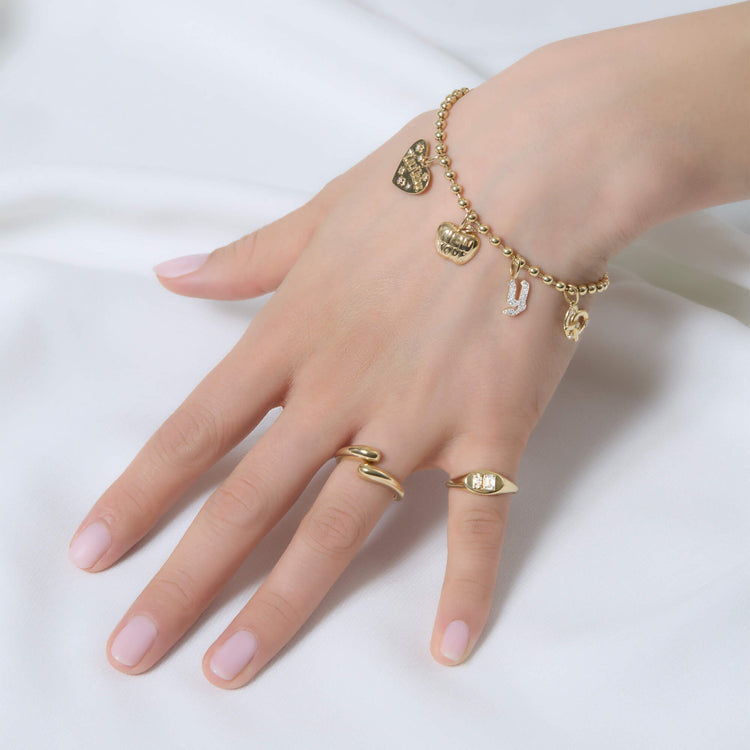 Model wearing Gold Ball Chain Bracelet with solid gold Stone and Strand jewelry