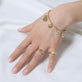 Model wearing Golden Droplet Hug Ring with solid gold Stone and Strand jewelry