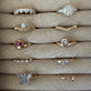 Still life image of Jumbo Butterfly Diamond Ring with Stone and Strand solid gold jewelry