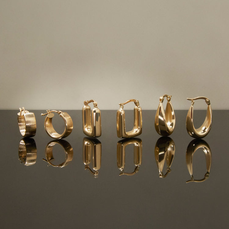 Still life image of Squared Off Hoops with Stone and Strand solid gold jewelry