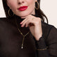 Model wearing Gothic Pave Initial Charm with solid gold Stone and Strand jewelry