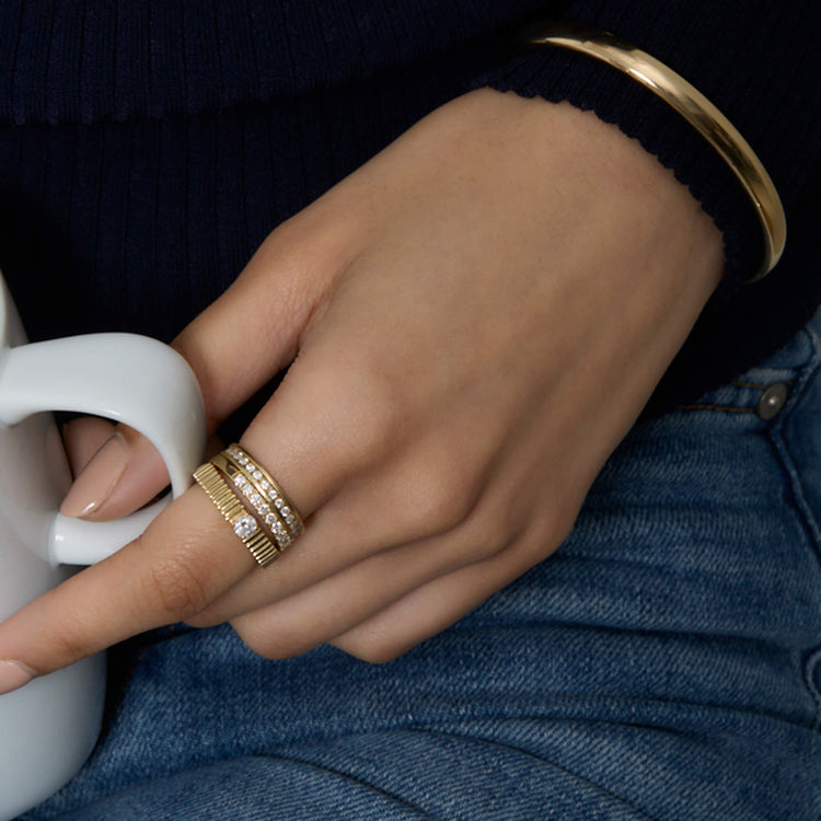 Model wearing Diamond Channel Ring with solid gold Stone and Strand jewelry