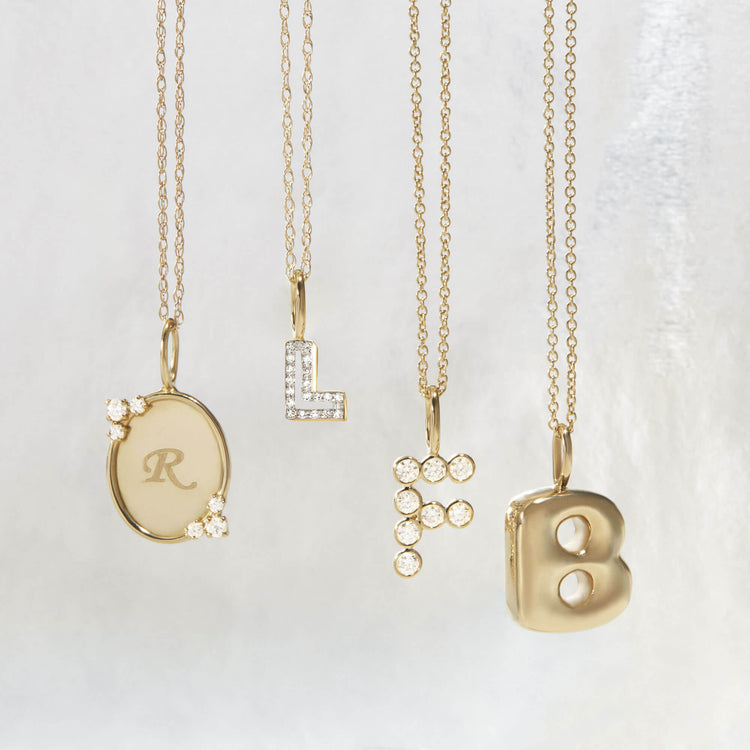 Still life image of Large Diamond Mochi Initial Necklace with Stone and Strand solid gold jewelry