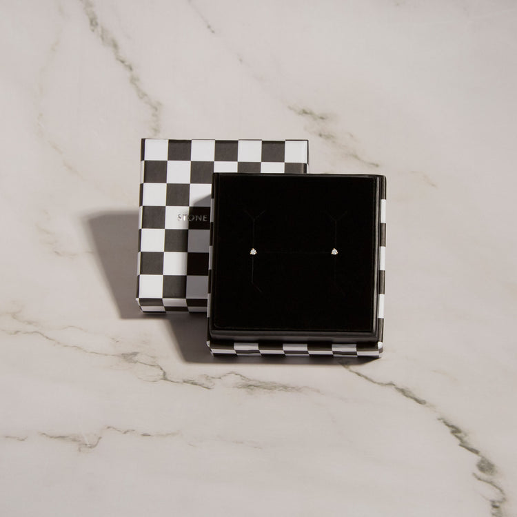 Still life image of Teeny Diamond Stud with Stone and Strand gift box