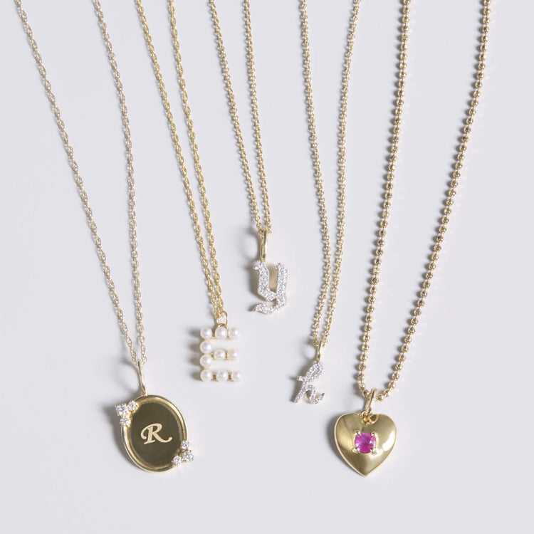 Still life image of Gothic Pave Initial Necklace with Stone and Strand solid gold jewelry
