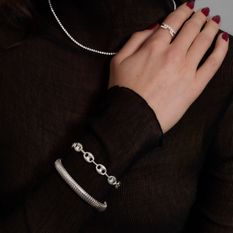 Model wearing Puffed Maritime Silver Bracelet with solid gold Stone and Strand jewelry