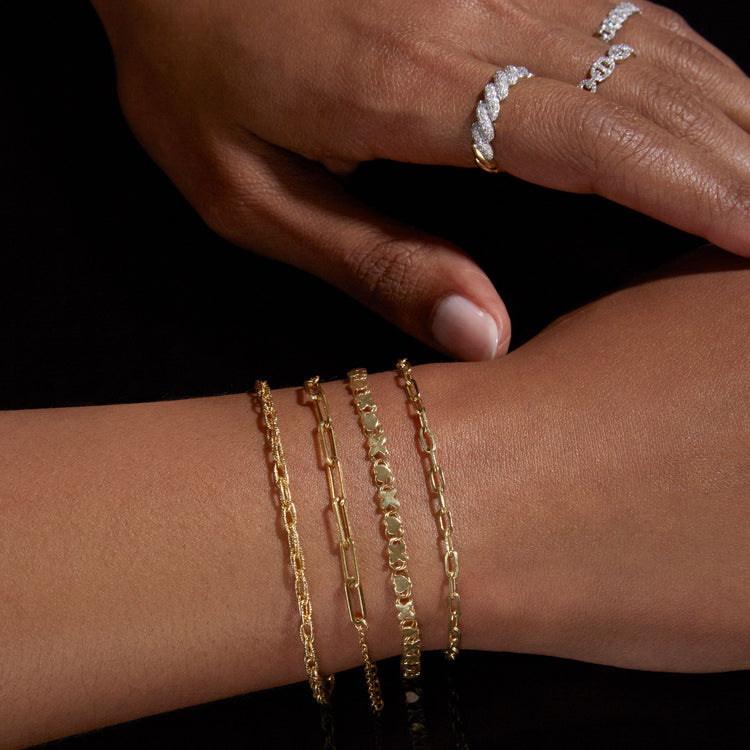 Model wearing Dainty Paperclip Bracelet with solid gold Stone and Strand jewelry