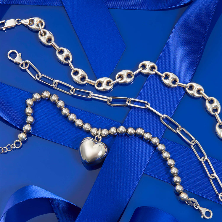 Still life image of Bold Paper Clip Bracelet with Stone and Strand solid gold jewelry