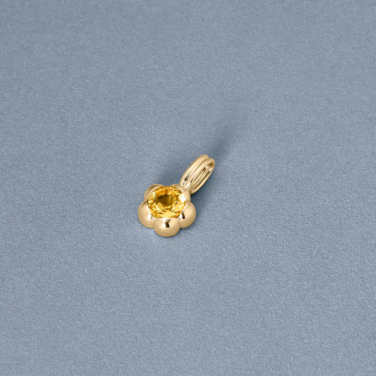 Stone and Strand 14K Yellow Gold Sunburst Citrine Charm Editorial Image