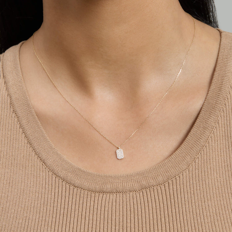 Image of 14K Yellow Gold Tagged Diamond Pendant on Models Neck