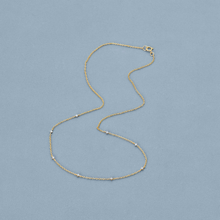 Stone and Strand 10K Yellow Gold Teeny Diamond Drizzle Necklace Editorial Image