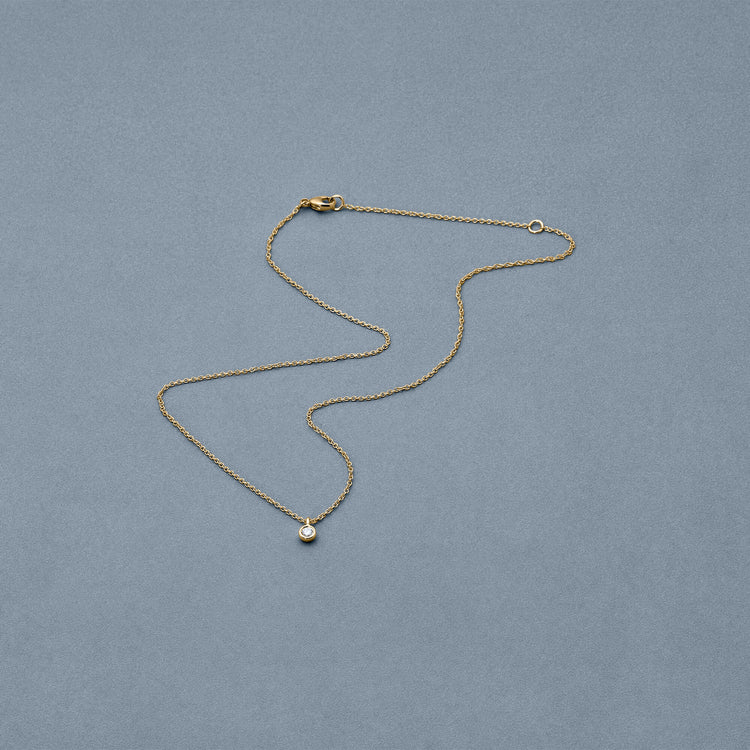Stone and Strand 14K Yellow Gold The Essential Dainty Diamond Solitaire Necklace Editorial Image