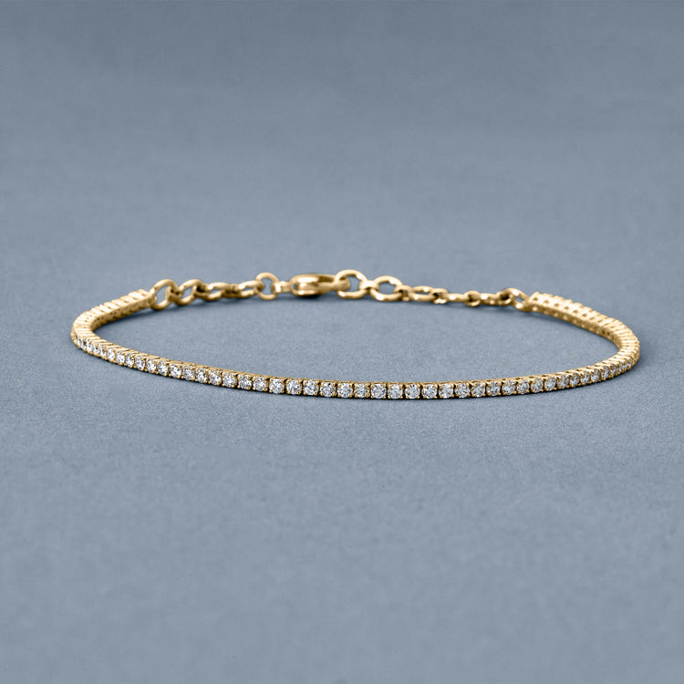 Stone and Strand 14K Yellow Gold The Essential Dainty Tennis Bracelet Editorial Image