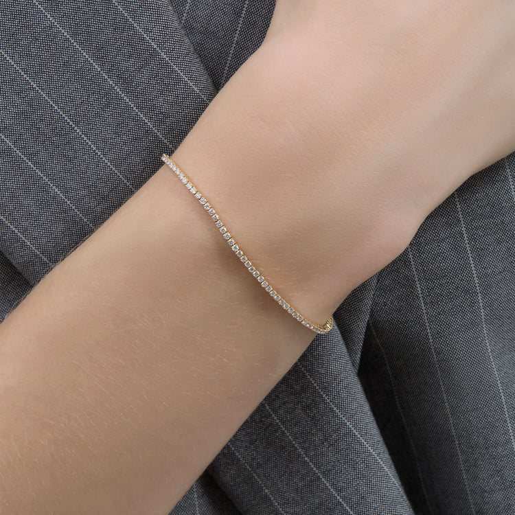 Image of 14K Yellow Gold The Essential Dainty Tennis Bracelet on Models Arm