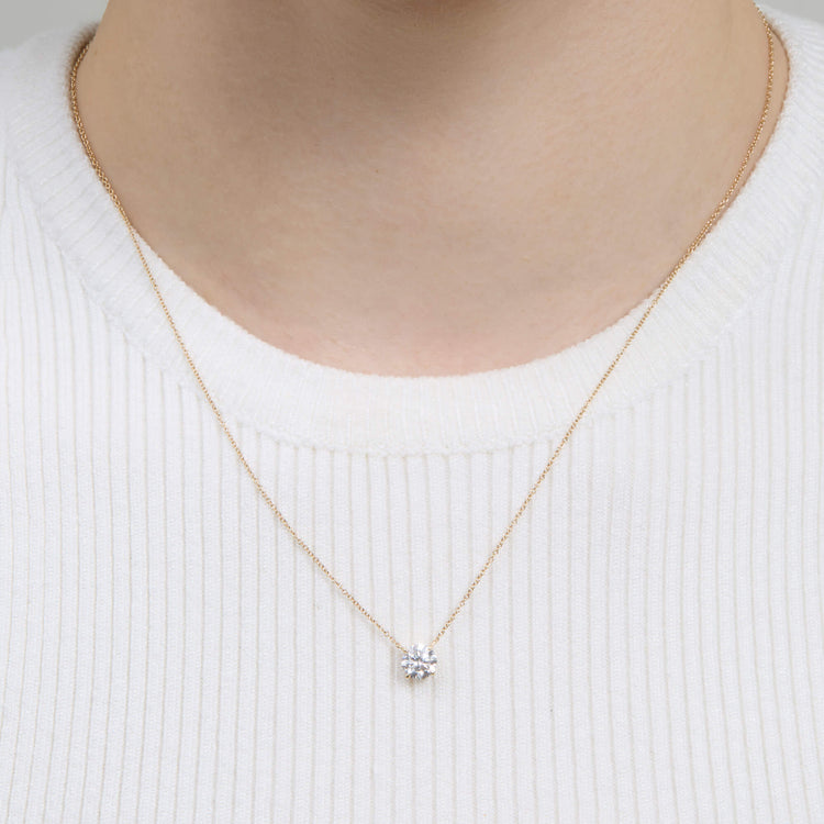 Image of 14K Yellow Gold The Essential Diamond Solitaire Necklace on Models Neck
