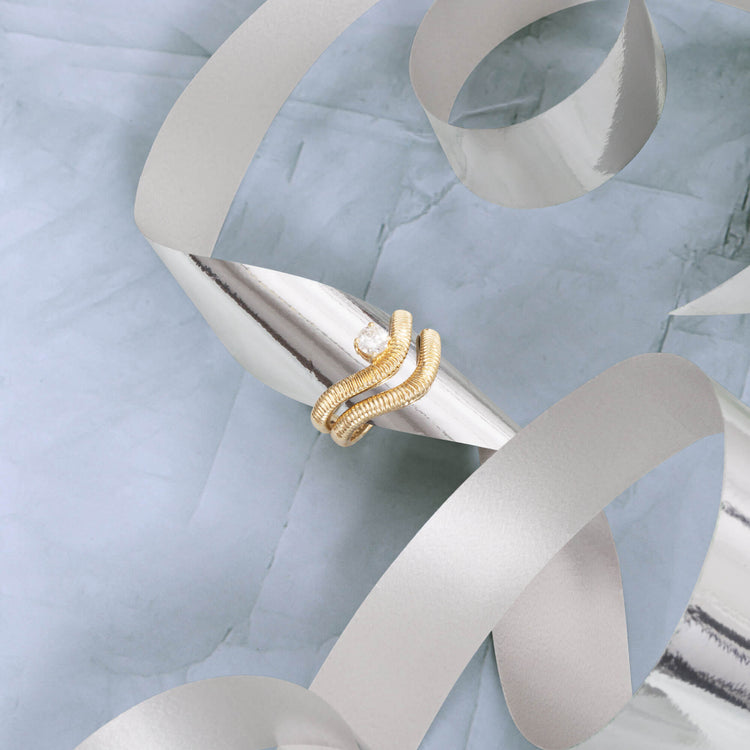 Still life image of The Tina Ring with Stone and Strand solid gold jewelry